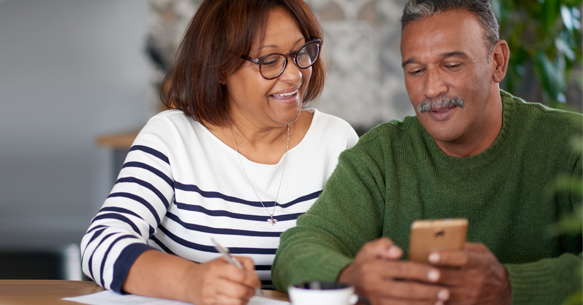Older couple using phone to protect financial information on mobile banking app Thumbnail