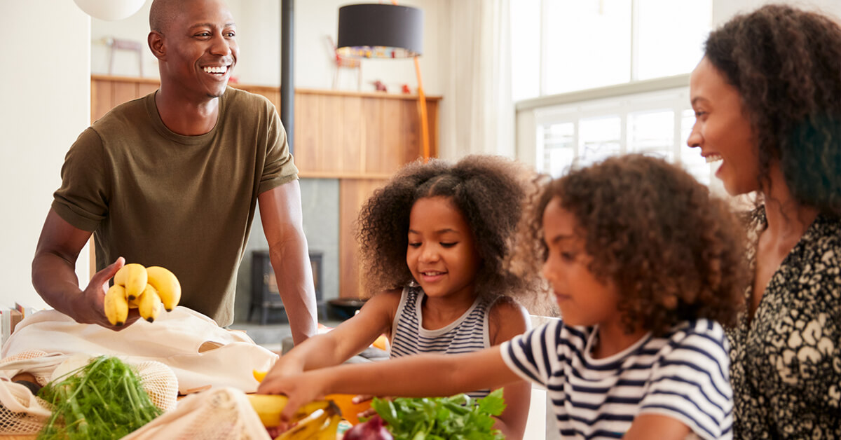 family unpacking groceries