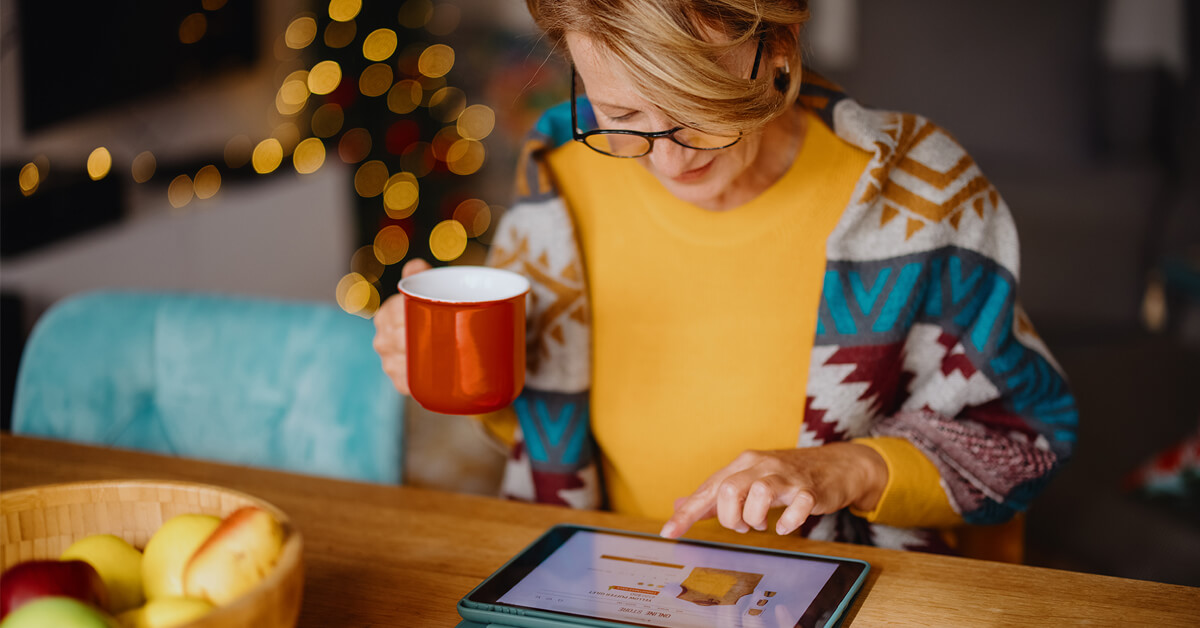 woman doing online shopping on a tablet